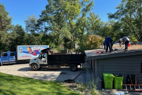 residential roofers replacing a homes roof