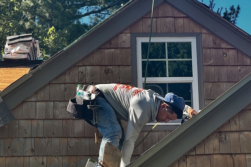 Roofman USA Roofing company replacing a Troy, Michigan home