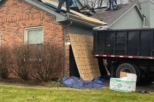 Roofman residential roofers working on residential ann arbor home for a roof replacement