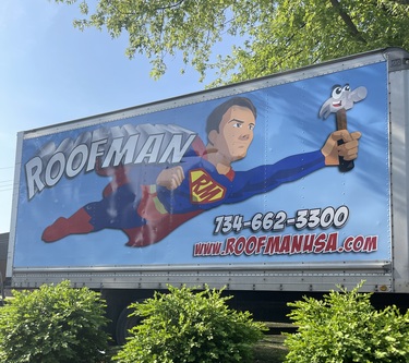 Roofman USA working to replace a roof on a Detroit resident's home