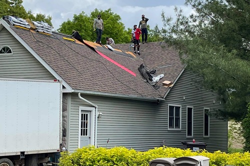 roofers on one story house