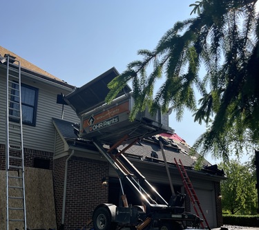Roofman USA performing roof repair on Ann Arbor resident's home