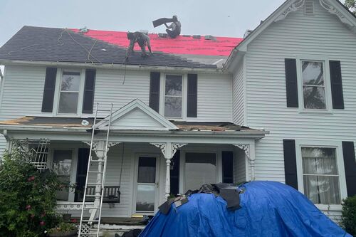 roofers working on a Brownstown home