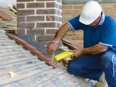 Roofman completing a roof installation. 