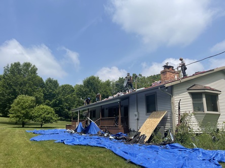 Roofman completing a roof job in Macomb, Michigan.