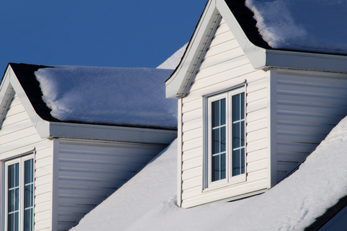 Roofman USA roofing crew working on a roof replacement in MI