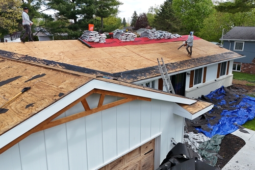 Residential roofers working in Dundee from Roofman USA working on a roof replacement project
