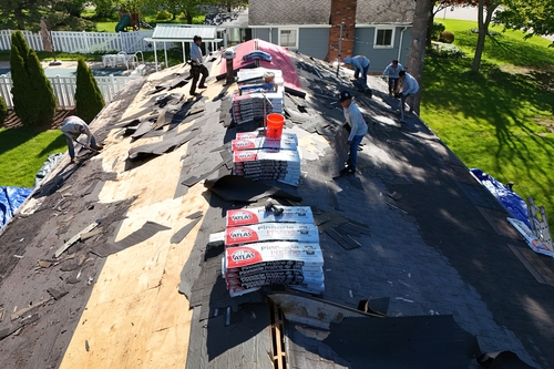 Residential roofers from Roofman USA working in Jackson, MI, on a roof replacement project
