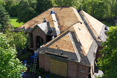 Roofman USA crew completing a roof replacement in Michigan