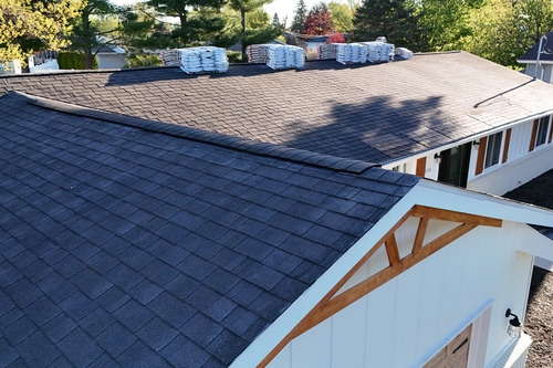 Roofman Roofing Company working on a resident's new roof